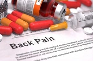 medication and back pain on paper