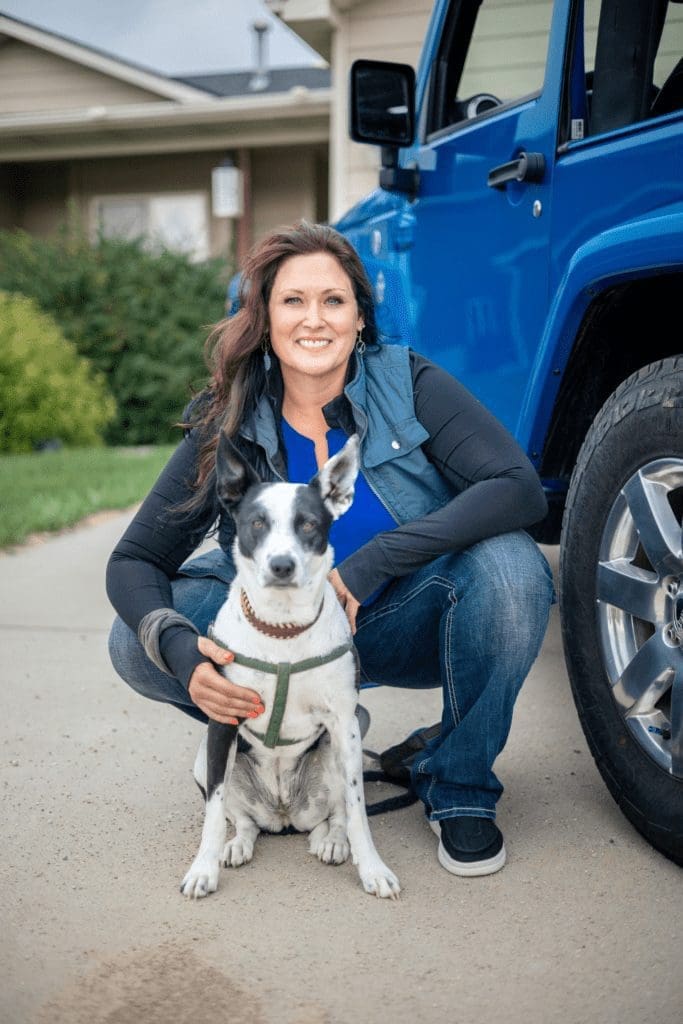 Wendy Iszler sitting behind her dog Ryla