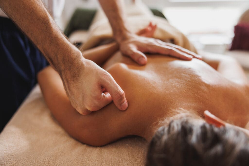 Close-up shoot of a young woman enjoying back massage