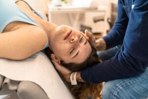 Female patient receives personalized chiropractic care