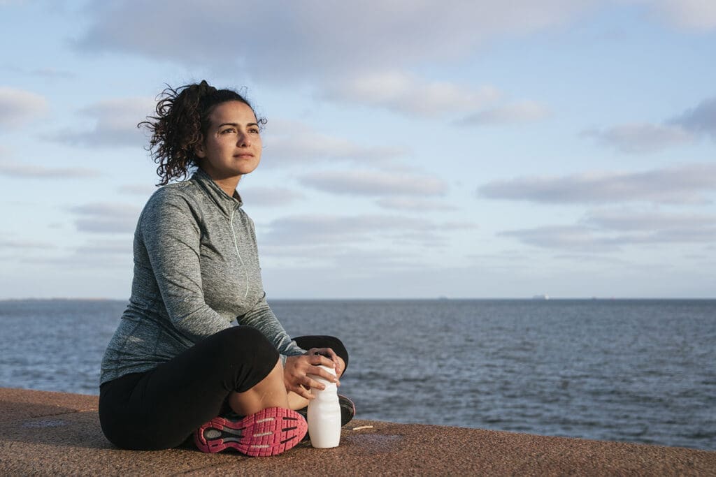 A woman takes a break after exercising.